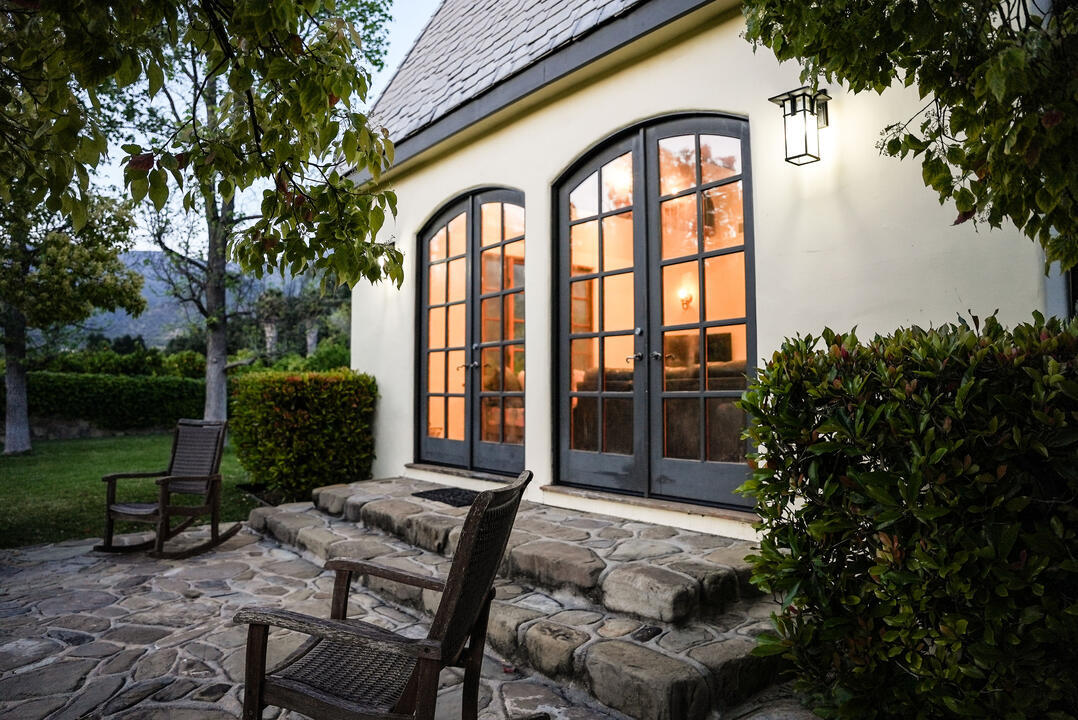 Outdoor rocking chairs and entrance to home