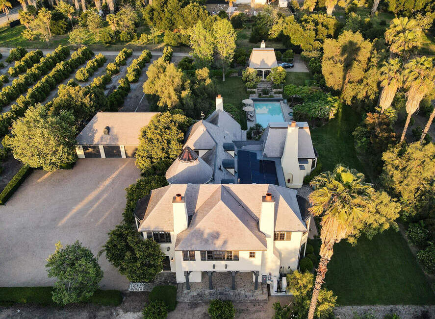 Arial view of Villa Valencia estate including house, parking, garages, pool, guest house, and citrus orchard.